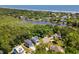 Aerial shot showing homes nestled near a lake with stunning ocean views in the distance at 77 Streater Ln., Pawleys Island, SC 29585