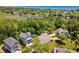 Aerial view of a home near a lake featuring lush trees and beautiful surroundings at 77 Streater Ln., Pawleys Island, SC 29585