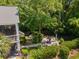 Aerial view of a private backyard with a hammock and outdoor seating area surrounded by lush greenery at 77 Streater Ln., Pawleys Island, SC 29585