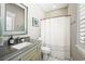 Bathroom featuring granite counters, ample lighting, and a shower and tub combo with a shower curtain at 77 Streater Ln., Pawleys Island, SC 29585