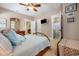 Comfortable bedroom featuring a wooden bed frame, carpeted floor, and a bathroom at 77 Streater Ln., Pawleys Island, SC 29585