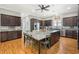 Gourmet kitchen with a large island, custom cabinets, stainless steel appliances, and hardwood floors at 77 Streater Ln., Pawleys Island, SC 29585