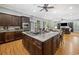 Modern kitchen with a large island, custom cabinets, and an open layout connecting to the living room at 77 Streater Ln., Pawleys Island, SC 29585