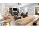 Comfortable living room featuring a fireplace, bookshelves, and plenty of natural light at 77 Streater Ln., Pawleys Island, SC 29585