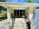 Back porch with brick stairs provides access to the backyard, perfect for outdoor enjoyment at 801 Talbot Circle, Myrtle Beach, SC 29577