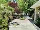 Backyard oasis with mature trees, landscaping, and unique water feature offers a relaxing outdoor retreat at 801 Talbot Circle, Myrtle Beach, SC 29577