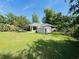 Spacious backyard featuring a well-maintained lawn, storage shed, and lush greenery, perfect for outdoor activities at 801 Talbot Circle, Myrtle Beach, SC 29577