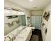 Modern bathroom featuring double sinks, a marble countertop, decorative mirrors, and modern lighting fixtures at 801 Talbot Circle, Myrtle Beach, SC 29577