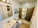 The bathroom has a vanity, toilet, and shower with sliding glass doors for a seamless design at 801 Talbot Circle, Myrtle Beach, SC 29577