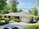 Traditional style home boasts a brick facade, attached garage, and a meticulously maintained landscape at 801 Talbot Circle, Myrtle Beach, SC 29577
