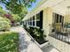 Charming exterior with brick accents, manicured landscaping, and screened porch, blends comfort and style at 801 Talbot Circle, Myrtle Beach, SC 29577