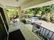 Charming front porch with seating area, offering an inviting space to relax and enjoy the well-maintained landscaping at 801 Talbot Circle, Myrtle Beach, SC 29577