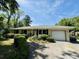 Charming single-story home with brick exterior, landscaped garden, and a well-maintained front yard with mature trees at 801 Talbot Circle, Myrtle Beach, SC 29577