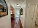 Inviting hallway showcases wood flooring, an accent rug, and provides a glimpse into the living area at 801 Talbot Circle, Myrtle Beach, SC 29577