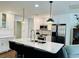 Modern kitchen with white cabinets, stainless steel appliances, and a stylish marble countertop island at 801 Talbot Circle, Myrtle Beach, SC 29577