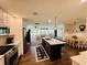 Open kitchen view into other living spaces with island sink, modern appliances, and dining table at 801 Talbot Circle, Myrtle Beach, SC 29577