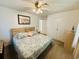 Serene main bedroom featuring a seashell-themed bedspread, beach decor, and ample closet space at 801 Talbot Circle, Myrtle Beach, SC 29577