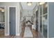 View of the light-filled foyer showcasing hardwood floors and an open floor plan at 804 Twickenham Loop, Longs, SC 29568