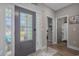 Foyer featuring decorative glass door, hardwood floors, and access to a bathroom and bedroom at 804 Twickenham Loop, Longs, SC 29568