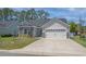 Charming single-story home with a two-car garage, stone accents, and a well-manicured lawn at 804 Twickenham Loop, Longs, SC 29568