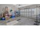 Spacious garage with an organized storage area, and a well-lit automatic garage door at 804 Twickenham Loop, Longs, SC 29568