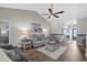 Comfortable living room with an open layout featuring hardwood floors and natural light at 804 Twickenham Loop, Longs, SC 29568