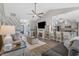 Spacious open concept living room featuring hardwood floors, fireplace and kitchen views at 804 Twickenham Loop, Longs, SC 29568