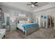 This bedroom has a trey ceiling, carpet, en suite bath, and walk in closet at 804 Twickenham Loop, Longs, SC 29568