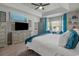 Carpeted bedroom with a trey ceiling and a sitting area by the large windows at 804 Twickenham Loop, Longs, SC 29568