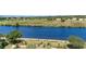 Gorgeous aerial view of a river meeting up with a lush golf course on a bright sunny day with fluffy white clouds at 8121 Amalfi Pl. # 4-801, Myrtle Beach, SC 29572