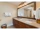 Bathroom showcasing double sinks with granite countertops and decorative mirror at 8121 Amalfi Pl. # 4-801, Myrtle Beach, SC 29572
