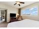 Bedroom featuring comfortable bed, ceiling fan, window view, and TV at 8121 Amalfi Pl. # 4-801, Myrtle Beach, SC 29572