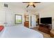 Bedroom with comfortable bed, tv, and bathroom at 8121 Amalfi Pl. # 4-801, Myrtle Beach, SC 29572