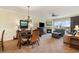Open-concept layout with a dining area, fireplace, comfortable seating, and balcony access with great views at 8121 Amalfi Pl. # 4-801, Myrtle Beach, SC 29572