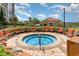 Enjoy the hot tub and the surrounding lounge chairs, tables, and landscaping in this attractive outdoor area at 8121 Amalfi Pl. # 4-801, Myrtle Beach, SC 29572