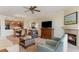 Open living space with fireplace, TV, and view into the kitchen and dining area at 8121 Amalfi Pl. # 4-801, Myrtle Beach, SC 29572
