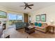 Inviting living room area, with a golf course view, cozy fireplace, and comfortable seating arrangements at 8121 Amalfi Pl. # 4-801, Myrtle Beach, SC 29572