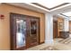 Elegant restaurant entrance with a view to the interior dining room with pillars and tile flooring at 8121 Amalfi Pl. # 4-801, Myrtle Beach, SC 29572