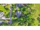 Aerial view of a home with lush landscaping, driveway, and mature trees at 813 Bear Lake Dr., Longs, SC 29568