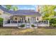 Spacious backyard with a patio, outdoor seating, and a well-maintained lawn at 813 Bear Lake Dr., Longs, SC 29568