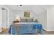 Well-lit bedroom featuring a decorative bed, painting and hat rack at 813 Bear Lake Dr., Longs, SC 29568