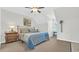 Charming bedroom features a decorative bed, a golf painting and a cozy window seat at 813 Bear Lake Dr., Longs, SC 29568