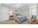 Cozy bedroom showcasing a bed, chair and a small table at 813 Bear Lake Dr., Longs, SC 29568