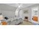 Bright bedroom featuring a bed, a chair and a door to another room at 813 Bear Lake Dr., Longs, SC 29568
