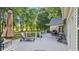 Relaxing outdoor deck with lounge chair, dining set, and golf course view at 813 Bear Lake Dr., Longs, SC 29568