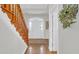 Inviting foyer with hardwood floors, staircase, and a view of the front door at 813 Bear Lake Dr., Longs, SC 29568