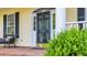 View of the home's front door with sidelights, decorative transom, and black privacy screen at 813 Bear Lake Dr., Longs, SC 29568