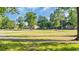 Scenic view of the golf course, showcasing lush greenery and mature trees at 813 Bear Lake Dr., Longs, SC 29568