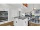 Gourmet kitchen featuring granite island, stainless steel appliances, and a connected dining area at 813 Bear Lake Dr., Longs, SC 29568