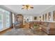 Spacious living room with hardwood floors and a view into the kitchen and other living spaces at 813 Bear Lake Dr., Longs, SC 29568